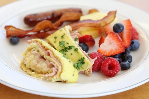 A Plate of Eggs, Berries, Bacon and Sausage