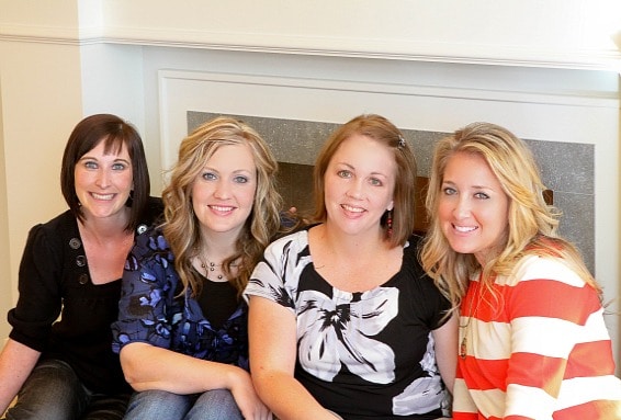 Four Female Food Bloggers Posing and Smiling on a Bench