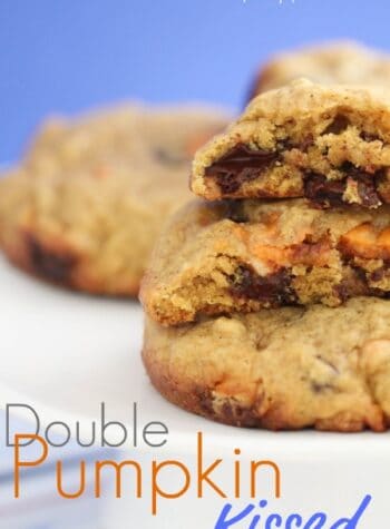 A few Double Pumpkin Kissed Chocolate Chunk Cookies in stacked.