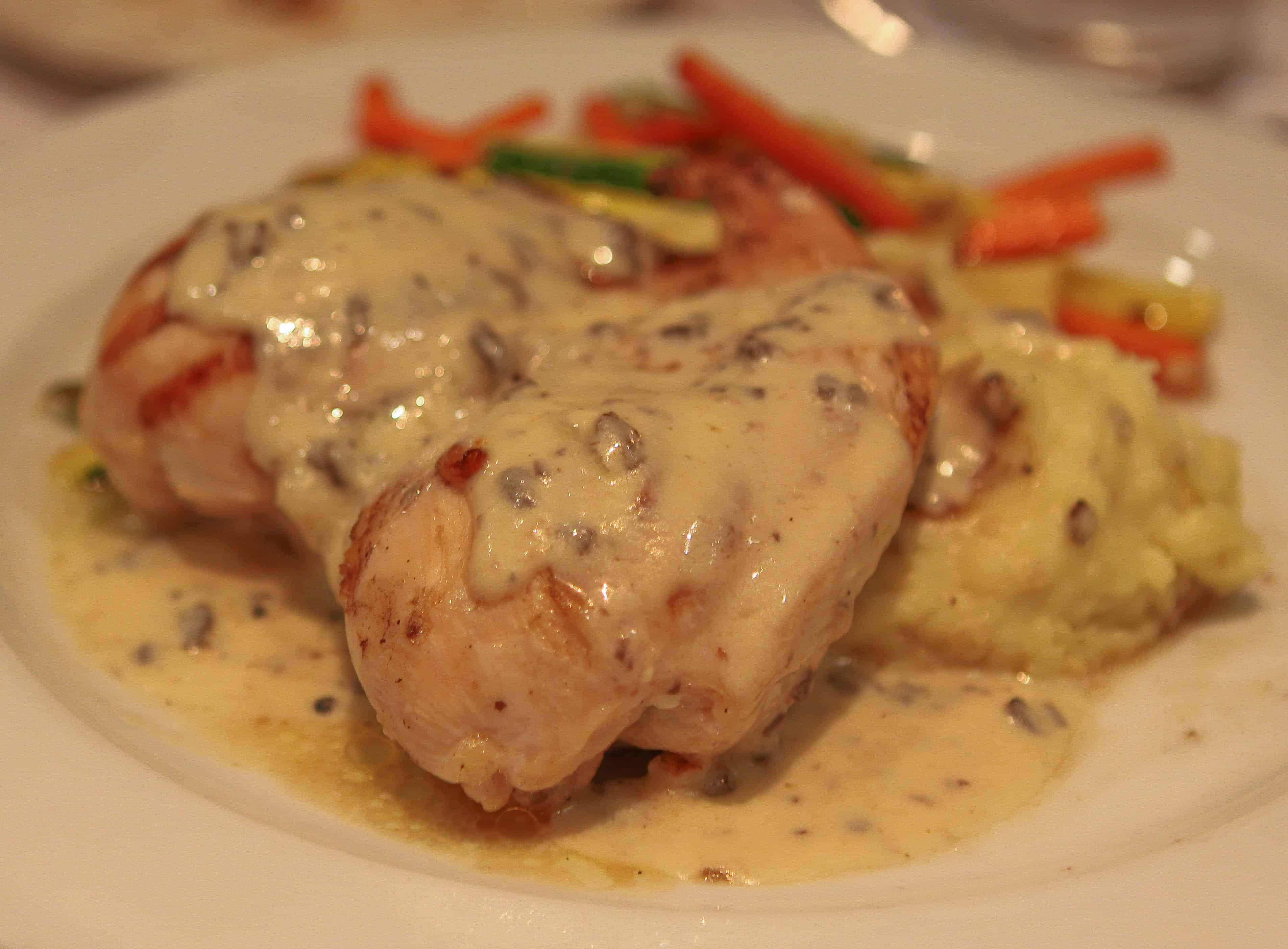 A Plate of Stuffed Chicken Breast with Blue Cheese and Mushrooms