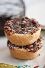 Two mini pumpkin pies with gingersnap streusel topping