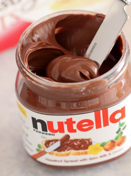 An open jar of Nutella spread.