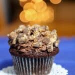 Chocolate mousse filled cupcake topped with crumbled Snickers candy