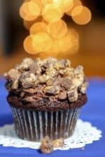 Chocolate mousse filled cupcake topped with crumbled Snickers candy