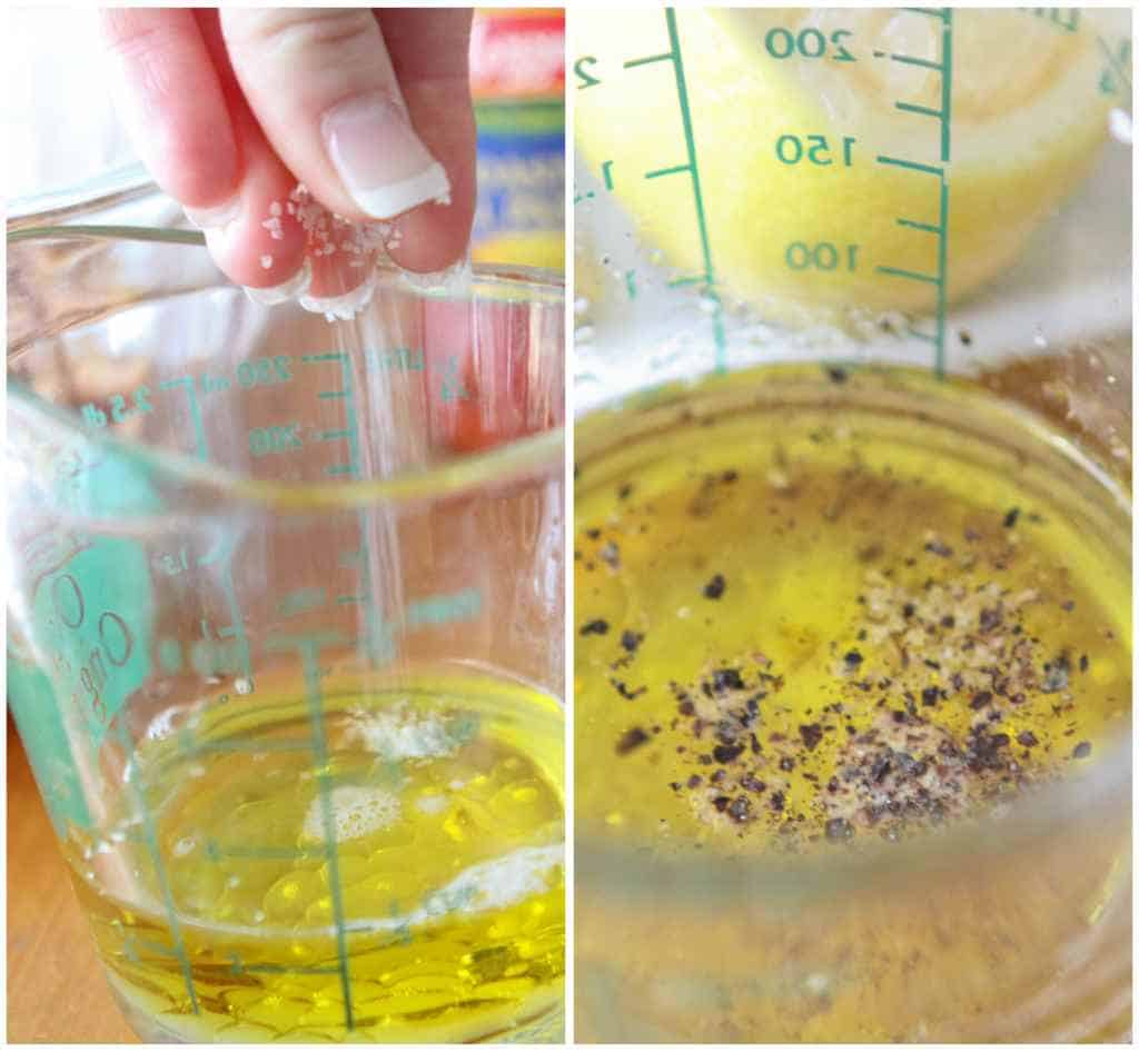 Salt and pepper is added to a measuring cup with olive oil.