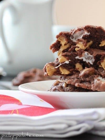 Chocolate, Peanut Butter & Marshmallow Pudding Cookies Stacked on a Plate