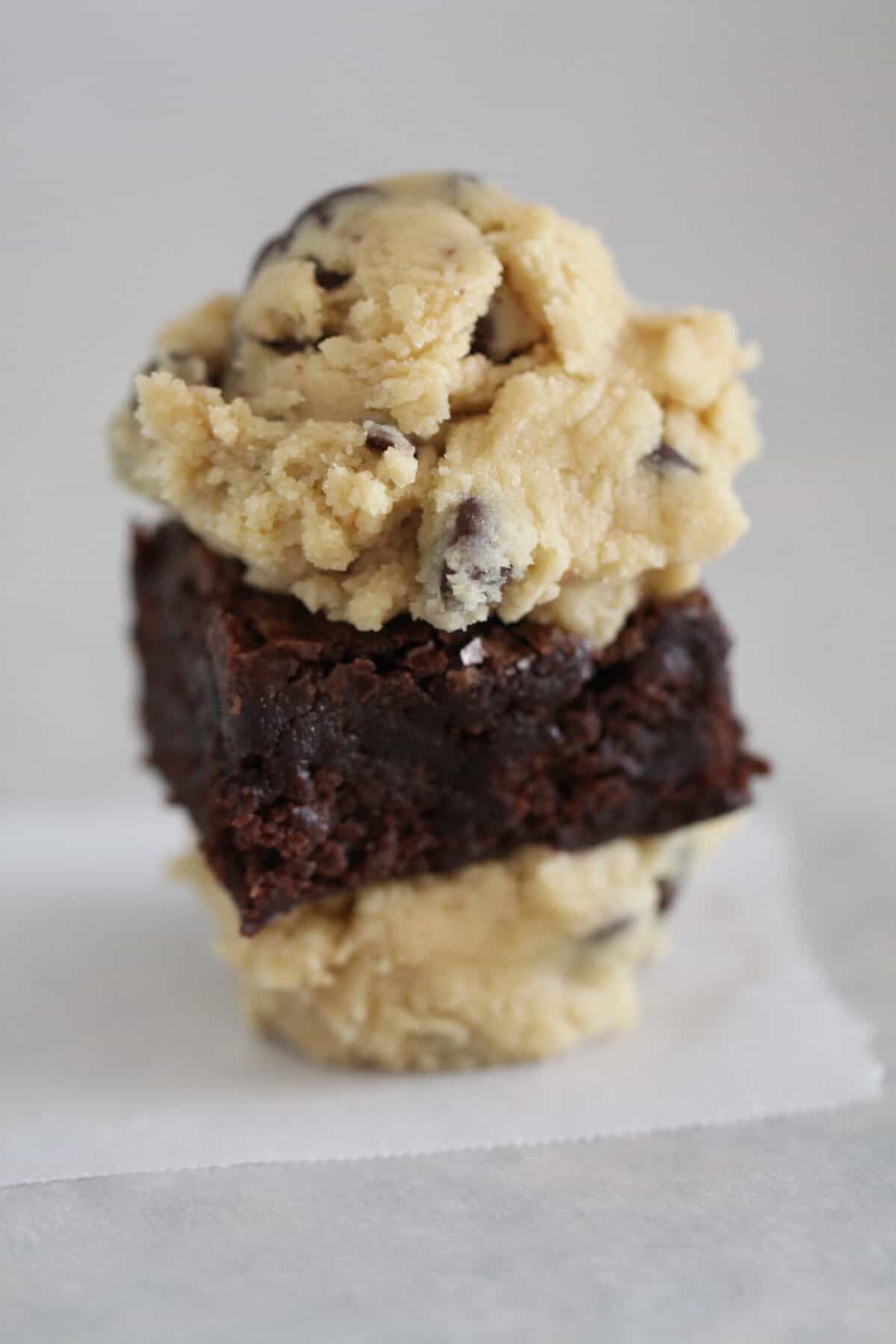 cookie dough on top and bottom of brownie square