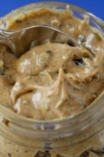 Scooping into a Jar of Cookies and Cream Peanut Butter