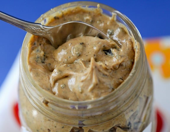 Scooping into a Jar of Cookies and Cream Peanut Butter