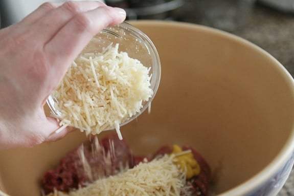 Parmesan Cheese being Added to the Bowl