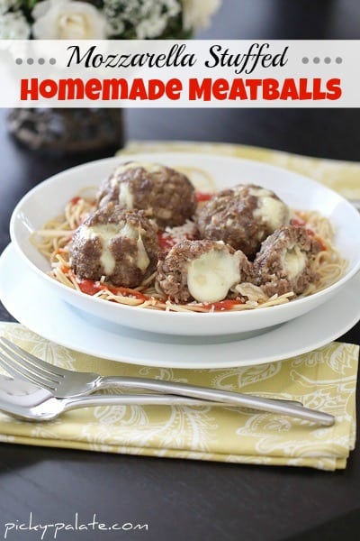 A Bowl of Spaghetti Topped with Gooey Mozzarella Stuffed Meatballs