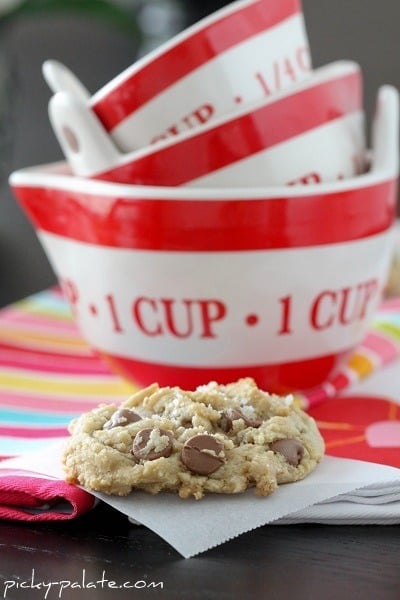 A Brown Butter and Fleur de Sel Chocolate Chip Cookie Next to Three Bowls
