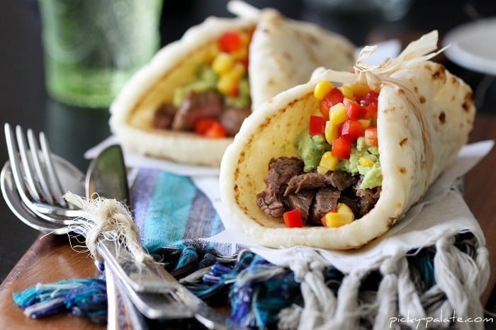 Two Carne Asada Soft Tacos with Guacamole and Corn