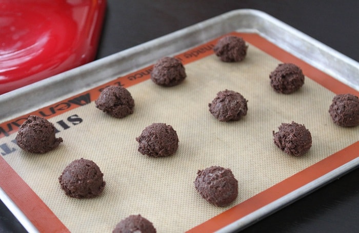 Bakery Style Cookies and Cream Cookie Dough Balls on a Baking Sheet