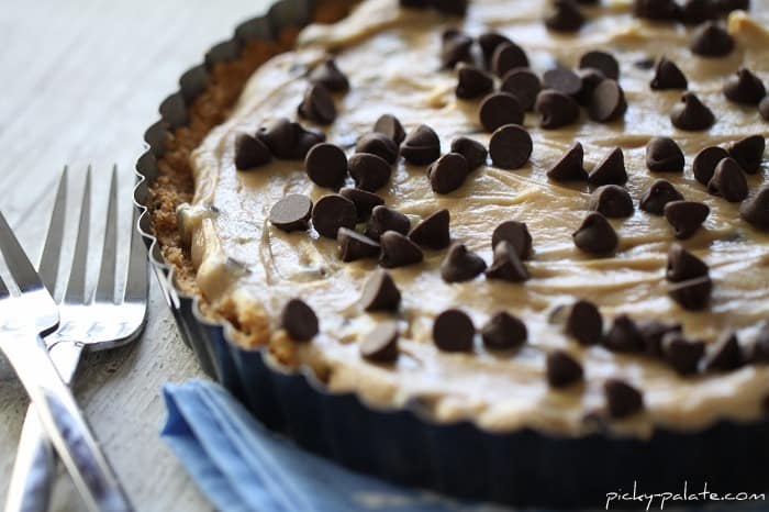 A Creamy Peanut Butter Chocolate Chip Tart with Two Forks