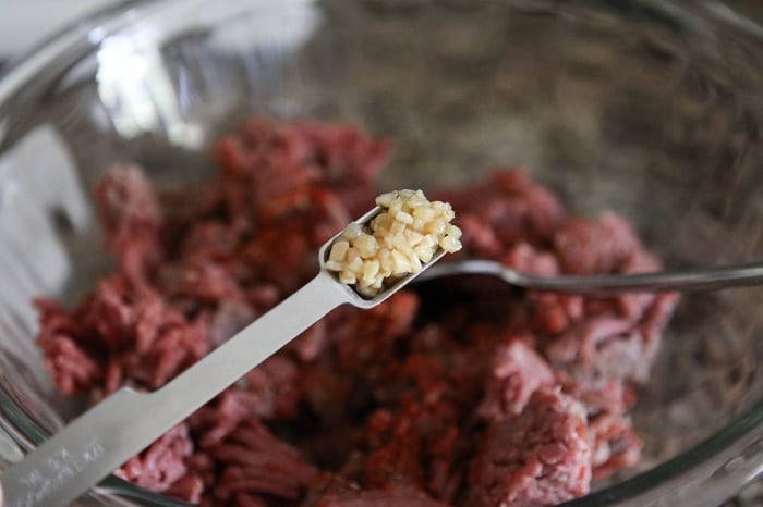 Image of Adding Minced Garlic to the Bowl