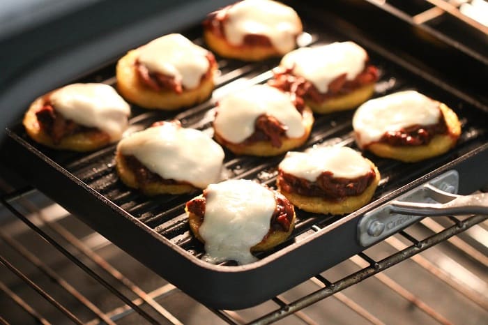 Image of BBQ Chicken Polenta Pizza Cakes in the Oven