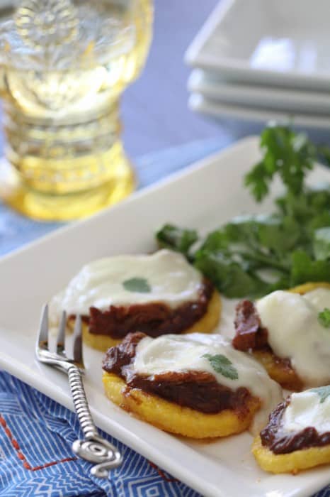 Image of BBQ Chicken Polenta Pizza Cakes with a Fork on a Plate