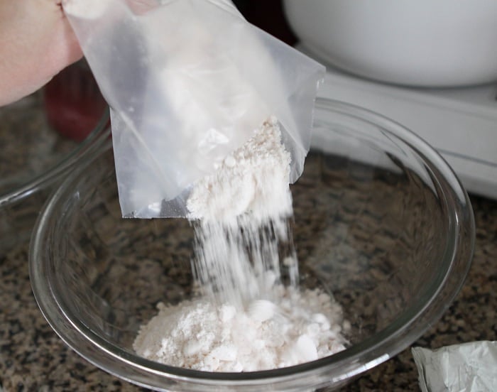 Image of Pouring Cake Mix in a Bowl