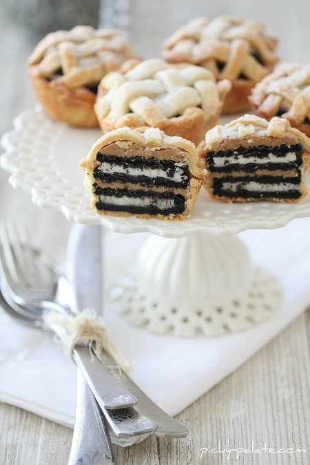 Image of Mini Oreo & Peanut Butter Lattice Pies on a Cake Stand