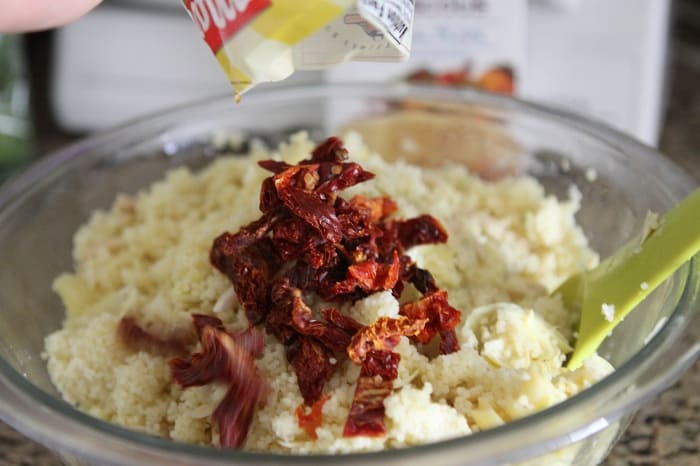 Image of Adding Sundried Tomatoes to the Salad