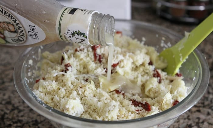 Image of Italian Dressing being Poured onto Salad