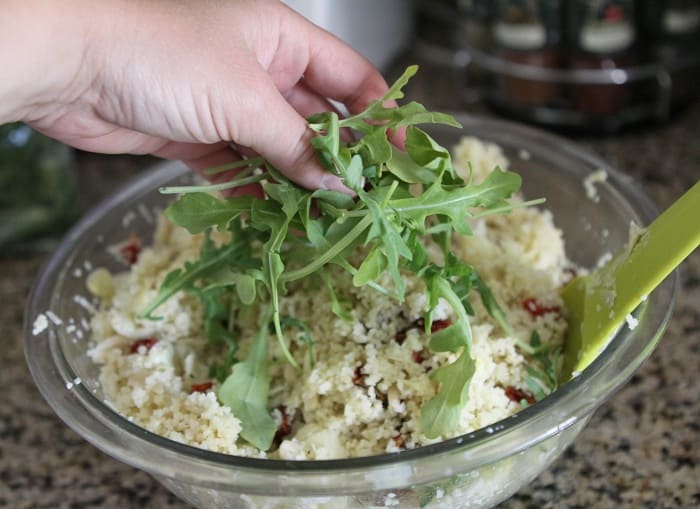 Image of Adding Arugula to the Salad