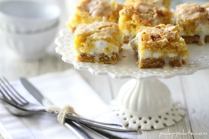 Image of White Chocolate S'mores Gooey Cake Bars on a Cake Stand