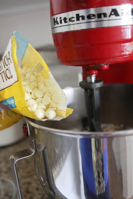 Image of White Chocolate Chips Being Added to The Bowl
