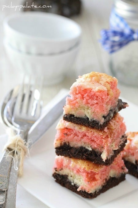 Image of Neapolitan Gooey Cake Bars Stacked on a Plate