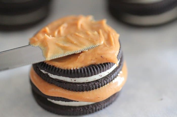 Image of Putting Peanut Butter on Oreos