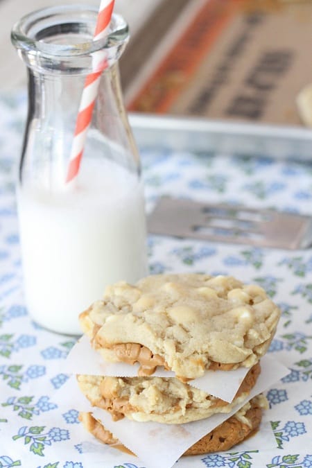 Image of Biscoff Stuffed White Chocolate Chip Cookies and a Glass of Milk