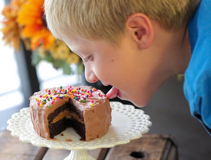 Image of My Son Tasting My Mini Chocolate Peanut Butter Cake