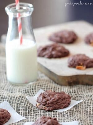 Image of Double Chocolate Snickers Chunk Cookies with a Glass of Milk