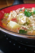 A bowl of hearty chicken stew with quinoa.