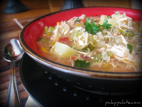 A bowl of hearty chicken stew with quinoa.