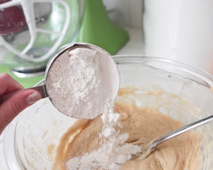 adding flour to mixing bowl for Best M&M Cookies