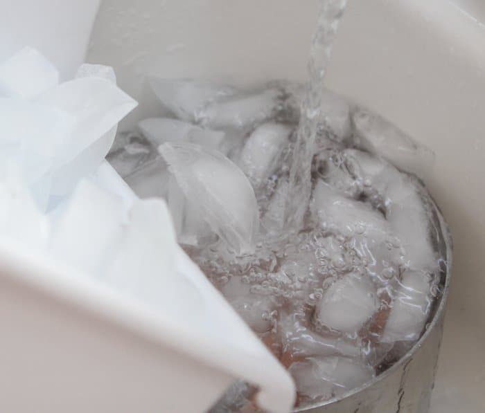 add ice water to pan of boiled eggs