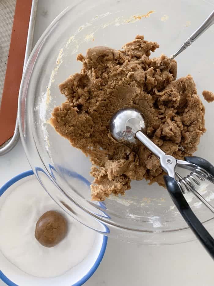 roll gingersnap cookie dough into balls