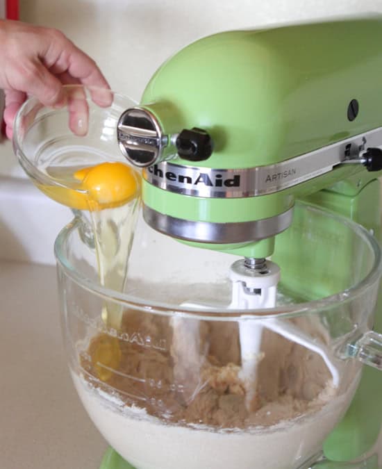adding egg to stand mixer for lemon cookies