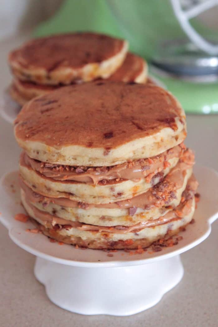 peanut butter pancakes stacked on cake stand