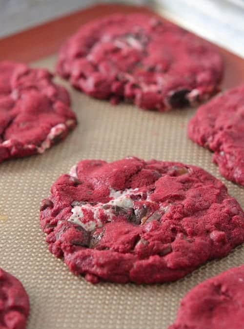 Red velvet cake mix cookies on a baking sheet.