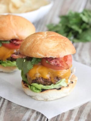 bacon cheeseburger on parchment paper