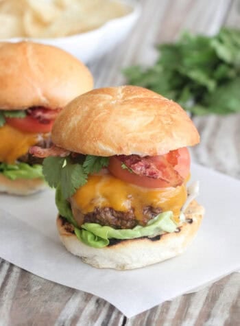 bacon cheeseburger on parchment paper