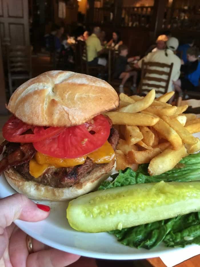 A Plate Holding a Liberty Tree Tavern Burger and Sides