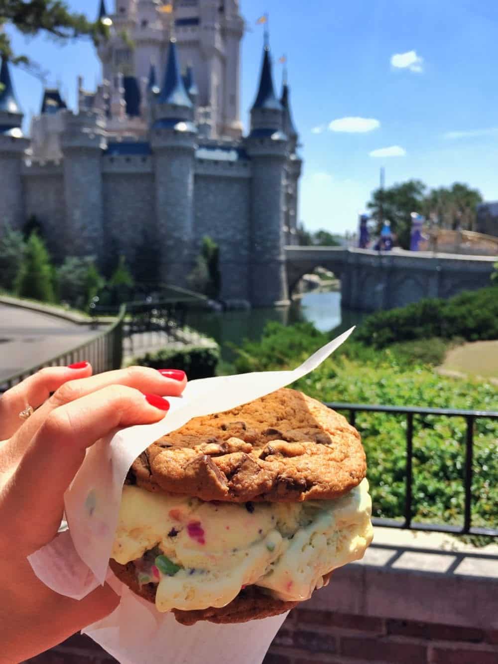 An Ice Cream Cookie Sandwich with the Disney Castle in the Background