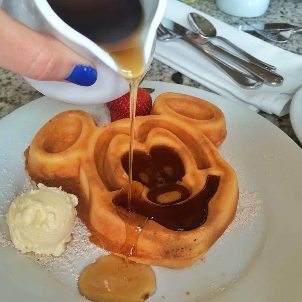 Syrup Being Poured over a Mickey Mouse Pancake