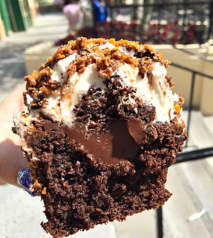 Jenny Holding Half of a Butterfinger Cupcake from Starring Rolls