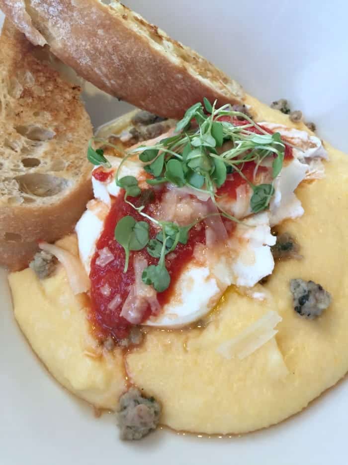 A Close-Up Shot of Pouched Eggs With Crispy Italian Bread on the Side