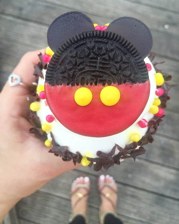 Jenny Holding a Mickey Mouse Cupcake While Wearing a Mickey Ring